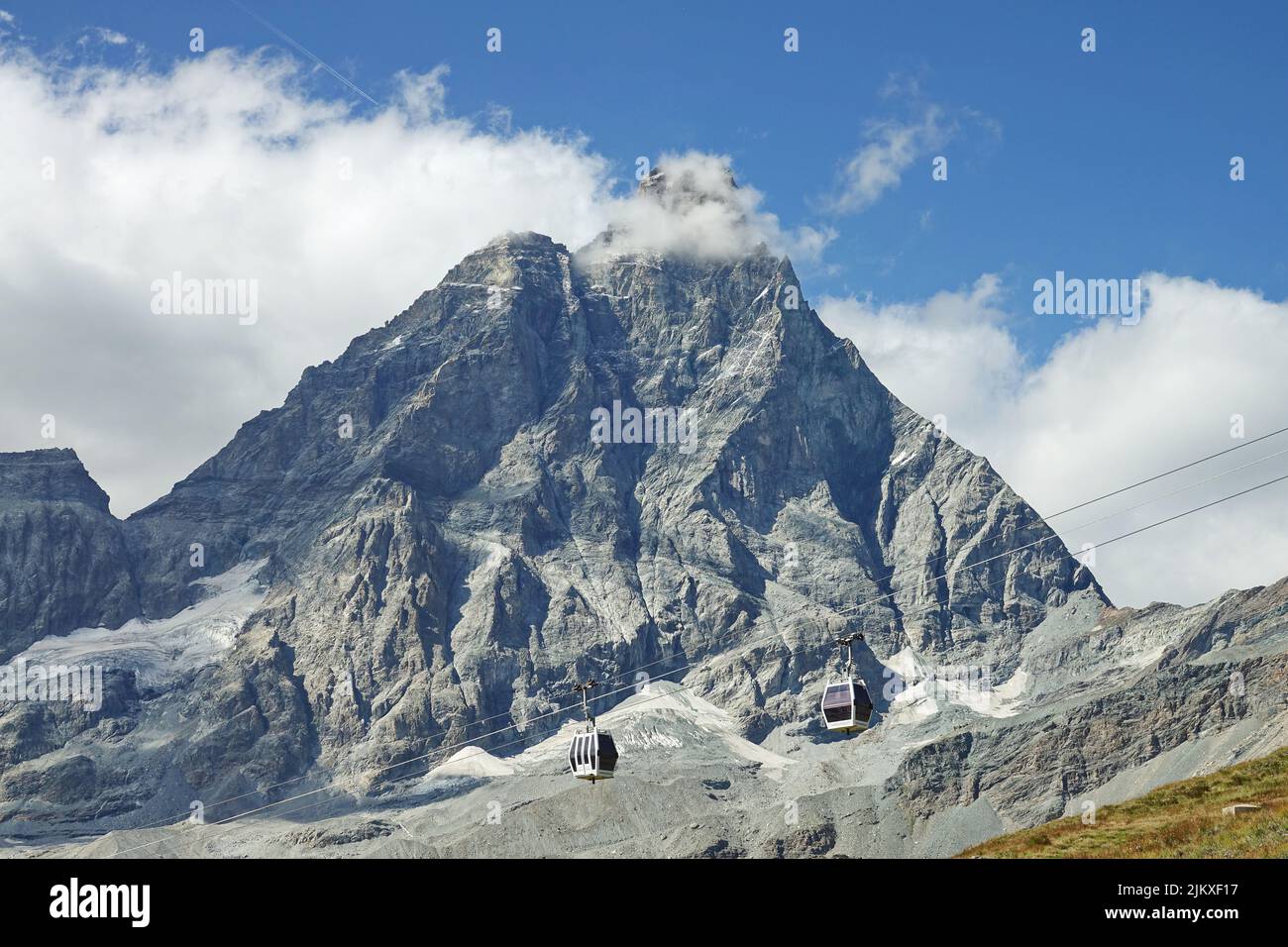 Matterhorn peak viewed from Italian side on a sunny day in summer. Breuil-Cervinia, Italy - August 2022 Stock Photo