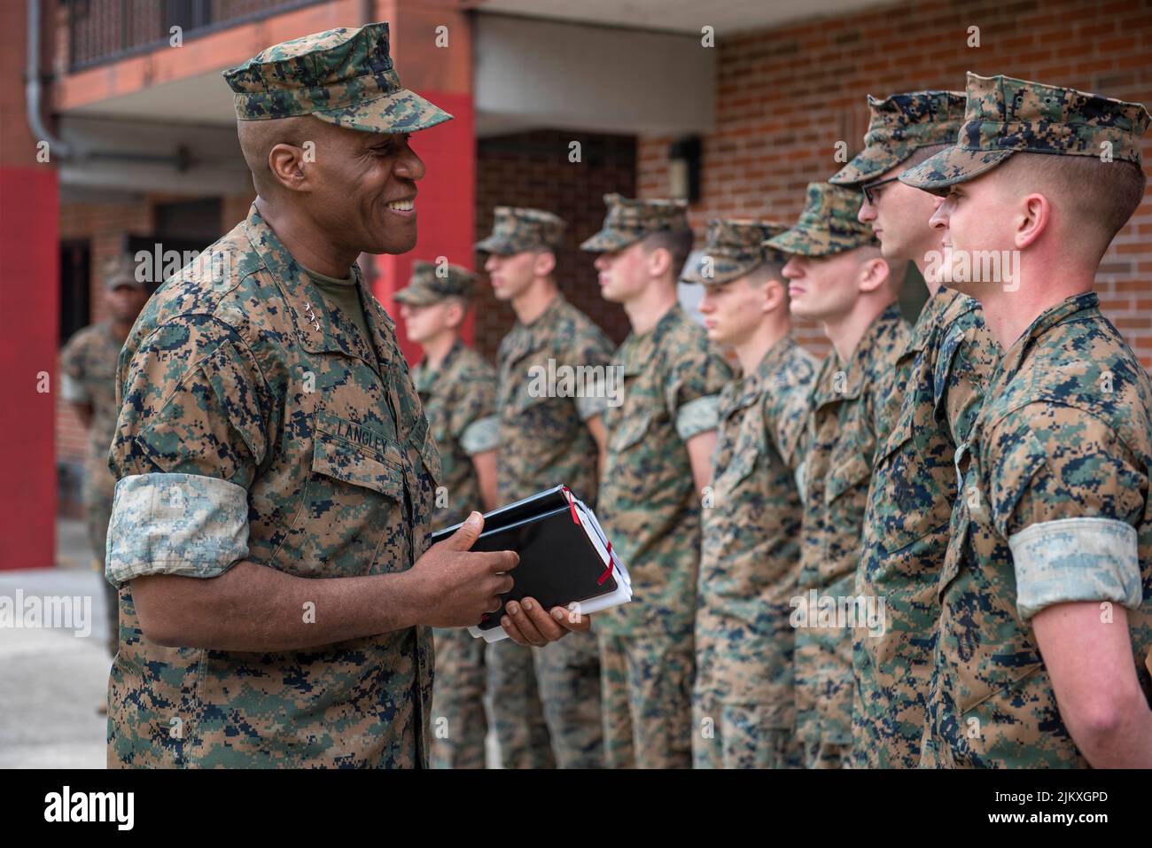 U.S. Marine Corps Lt. Gen. Michael E. Langley, left, commanding general of Marine Forces Command, talks with Marines in the courtyard of Marine Corps Security Force Battalion barracks March 30, 2022, in Kings Bay, Georgia. Langley will become the first Black four-star general in the Marines 246-year history, after the Senate confirmed his promotion August 3rd, 2022. Stock Photo