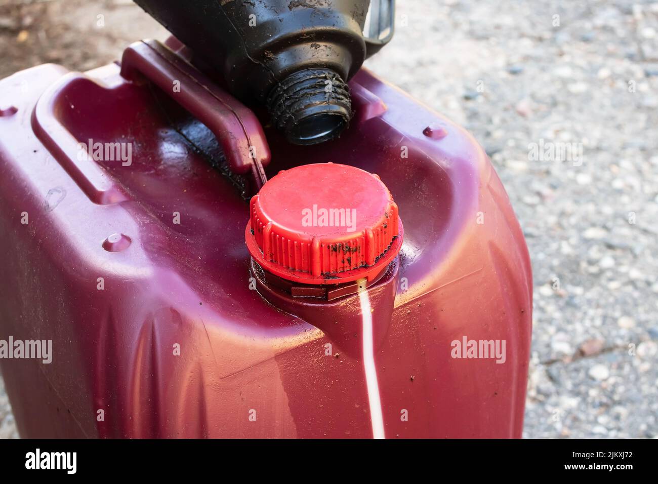 Large red canister of engine oil close up Stock Photo Alamy