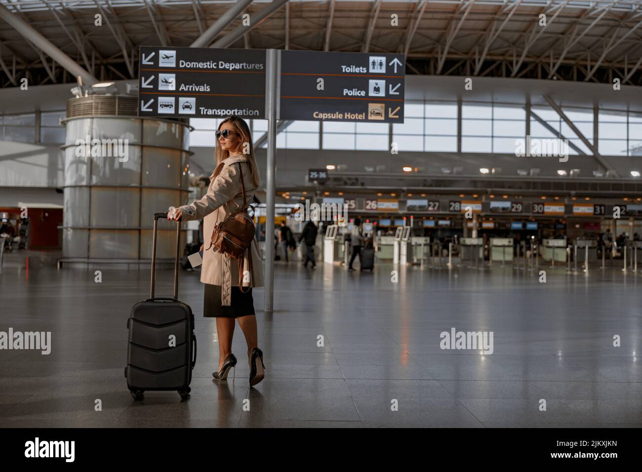 Woman suitcase in hall airport hi-res stock photography and images - Alamy