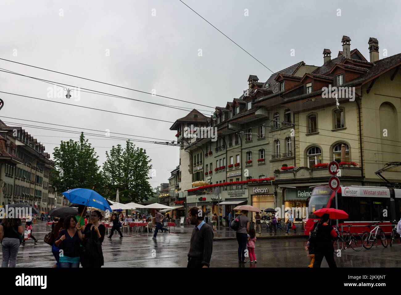 The people on the street in rainy weather in downtown Bern, Switzerland. Stock Photo