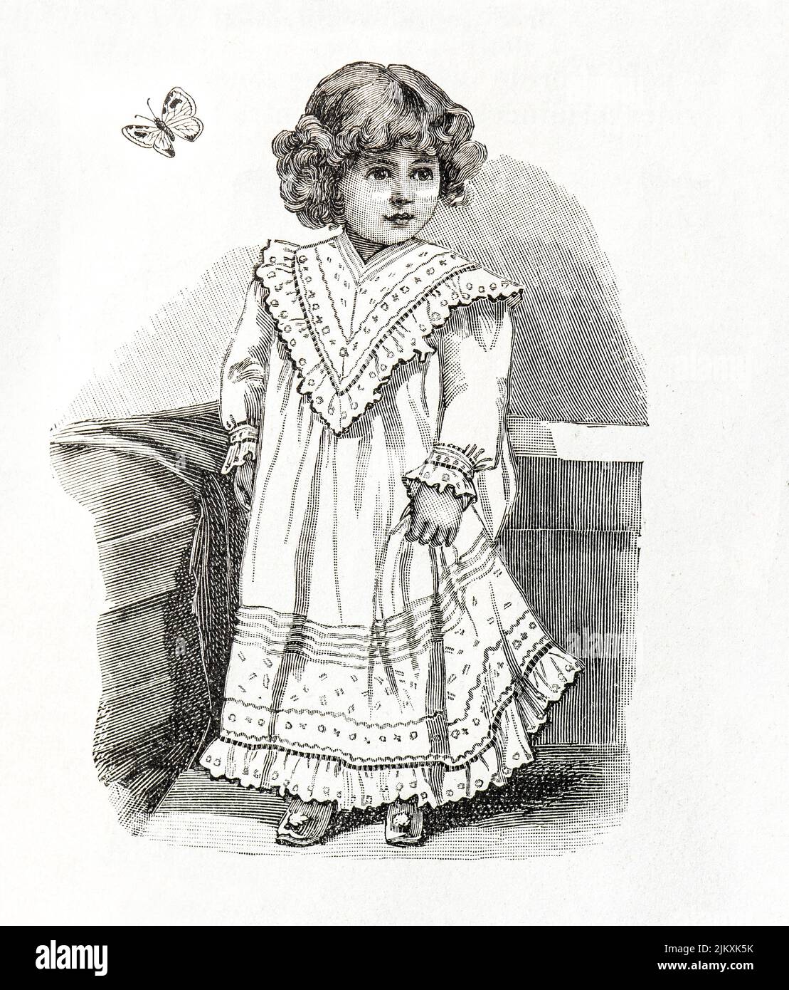 Baby girl wearing vintage dress. Antique engraving. 1901, France, Paris Stock Photo