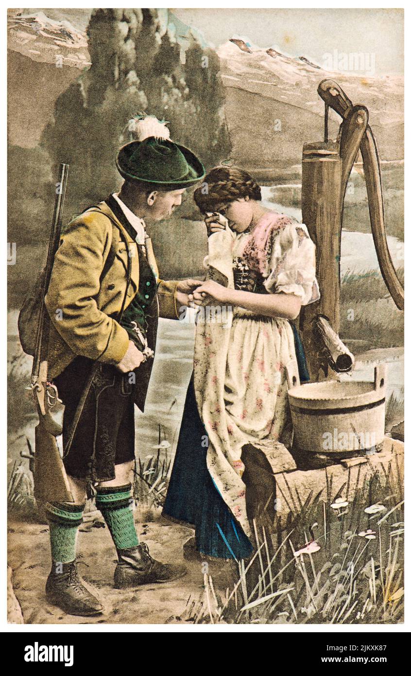 Couple in typical bavarian dress. Vintage german postcard Stock Photo
