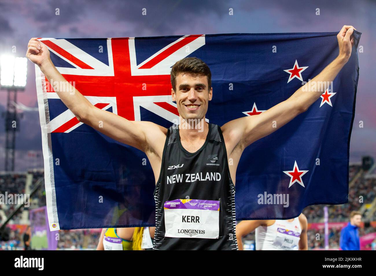 3rd August 2022; Alexander Stadium, Birmingham, Midlands, England: Day 6 of the 2022 Commonwealth Games: Hamish Kerr (NZL) with his national flag after winning the Gold Medal in the Men's High Jump Final with a height of 2.25m Stock Photo