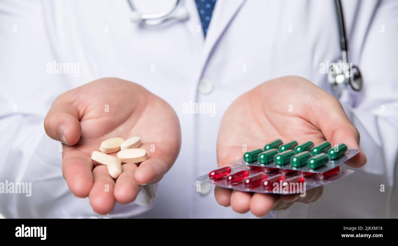 pills and medications. hands hold medication. vitamin pills in blister Stock Photo