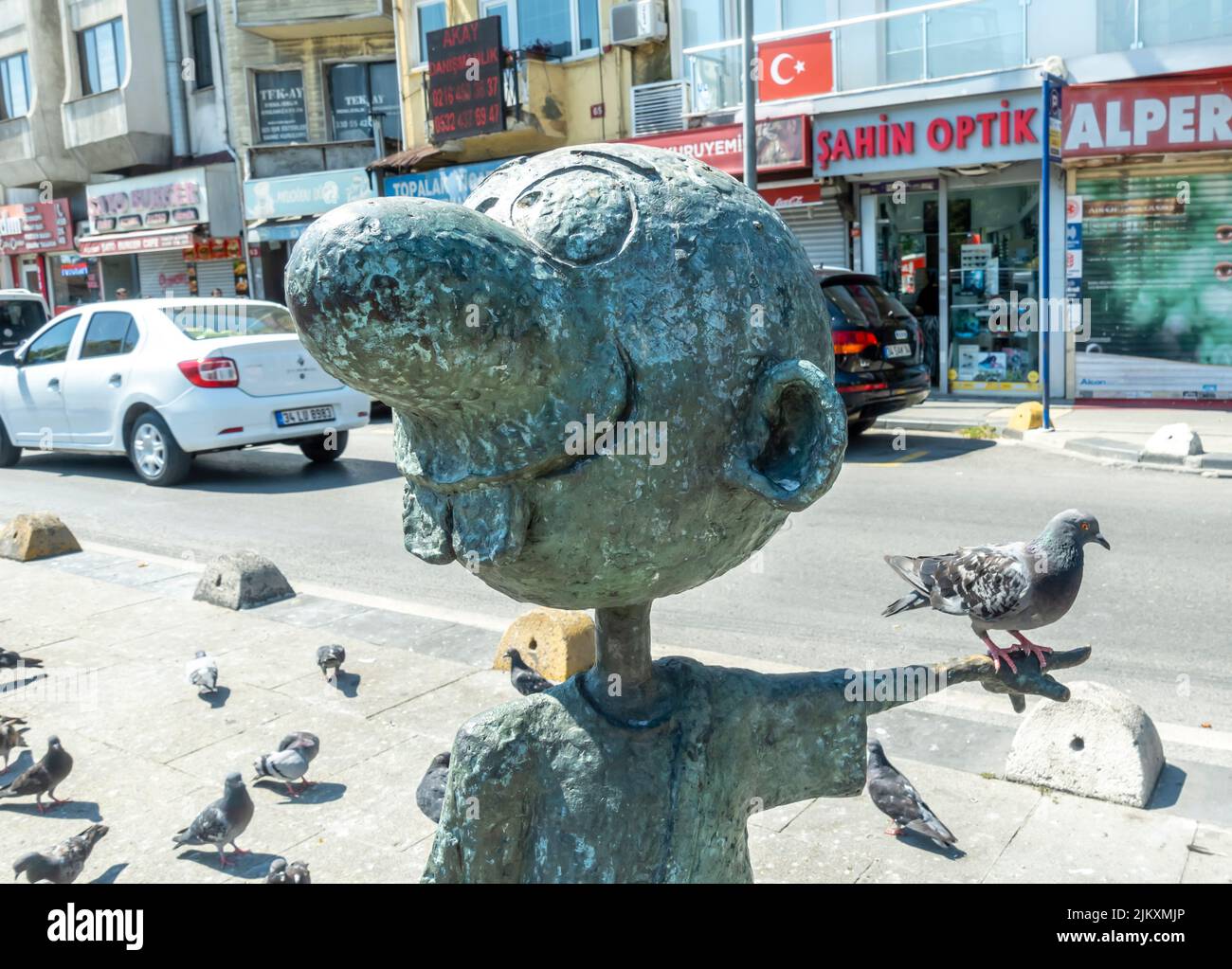 Bronze street sculpture os a kid near Abidik ile kubidik istanbul