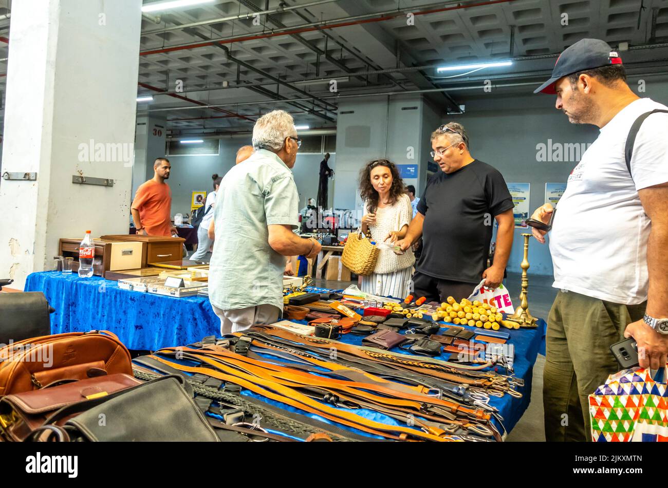 Used second-hand leather goods seller selling at Tuesday market (Salı Pazarı) in Istanbul, Turkey Stock Photo