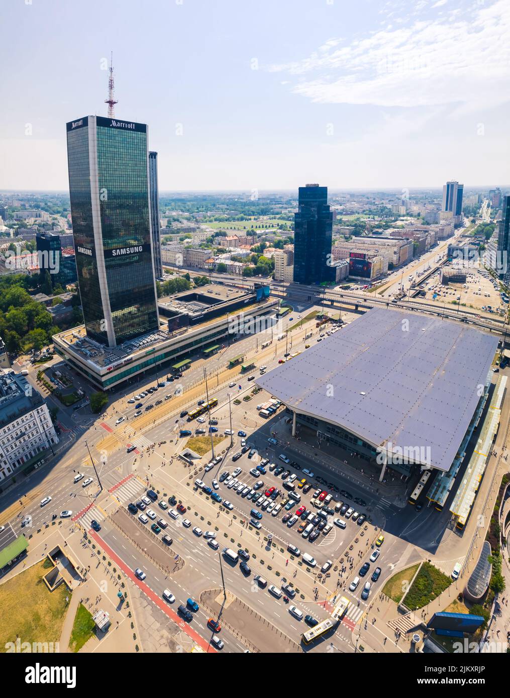 7.22.2022 Warsaw, Poland. Vertical drone aerial shot of Central Railway Station and Central LIM Skyscraper. Beautiful weather. Transportation concept. High quality photo Stock Photo