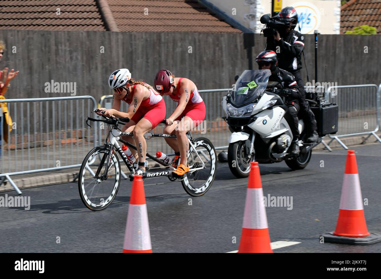 Katie Crowhurst and guide competing in the bike stage of the 2022 Birmingham Commonwealth Games Paratriathlon event. Stock Photo