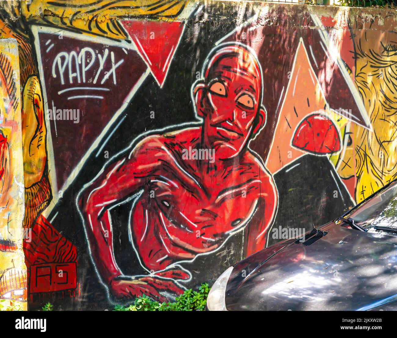 Street art, mural by Papyx depicting a red man in Moda, Kadiköy district of Istanbul, Turkey Stock Photo