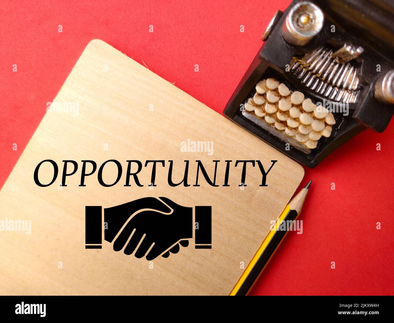 Typewritter,pencil and icon with text OPPORTUNITY on red background ...