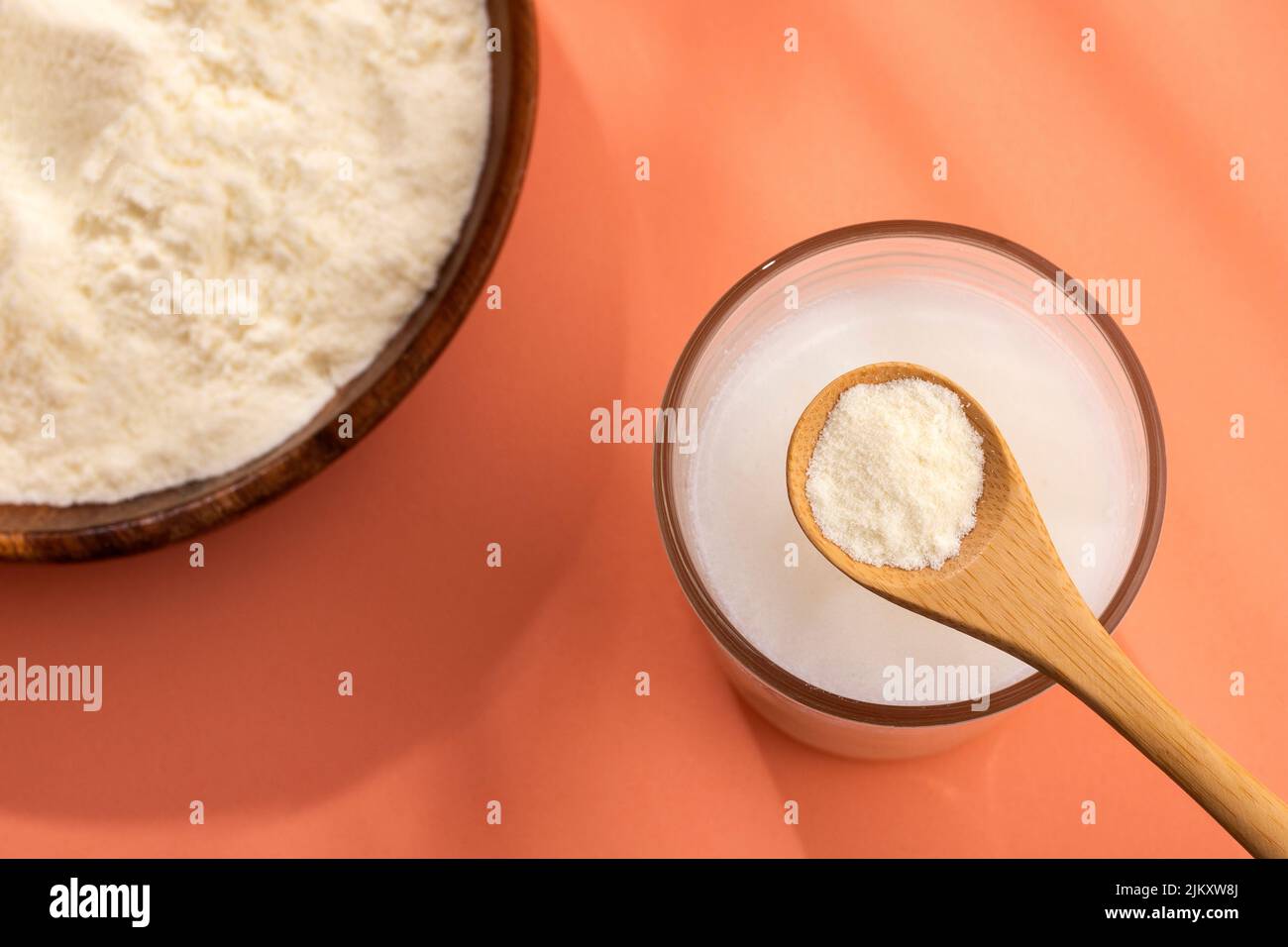 Powdered milk mix in the glass with water Stock Photo