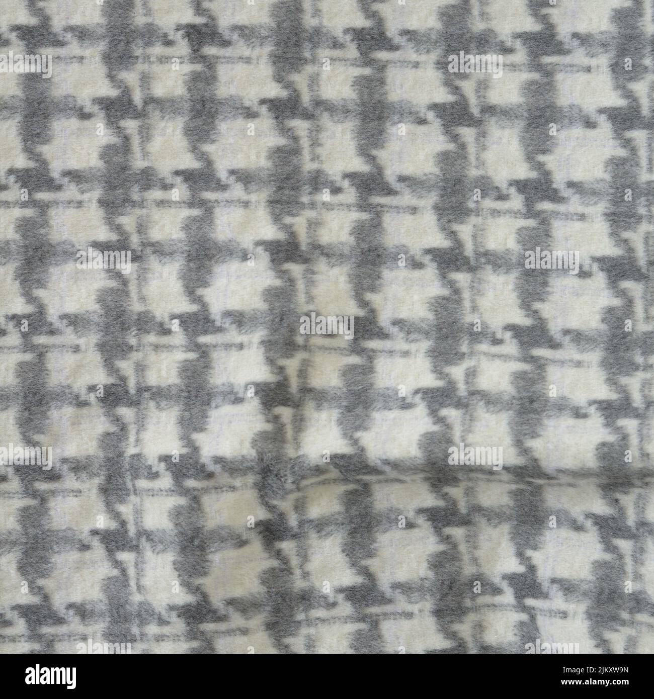 A close-up shot of a Houndstooth wool fabric - perfect for wallpapers Stock Photo