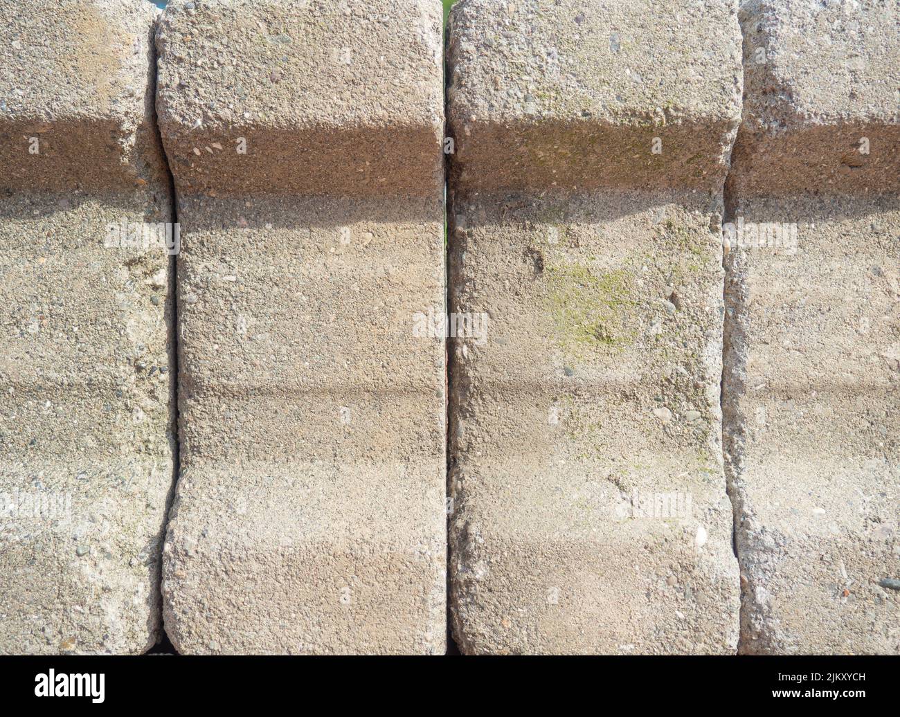 Concrete wall. Concrete tiles on top of each other. stone surface