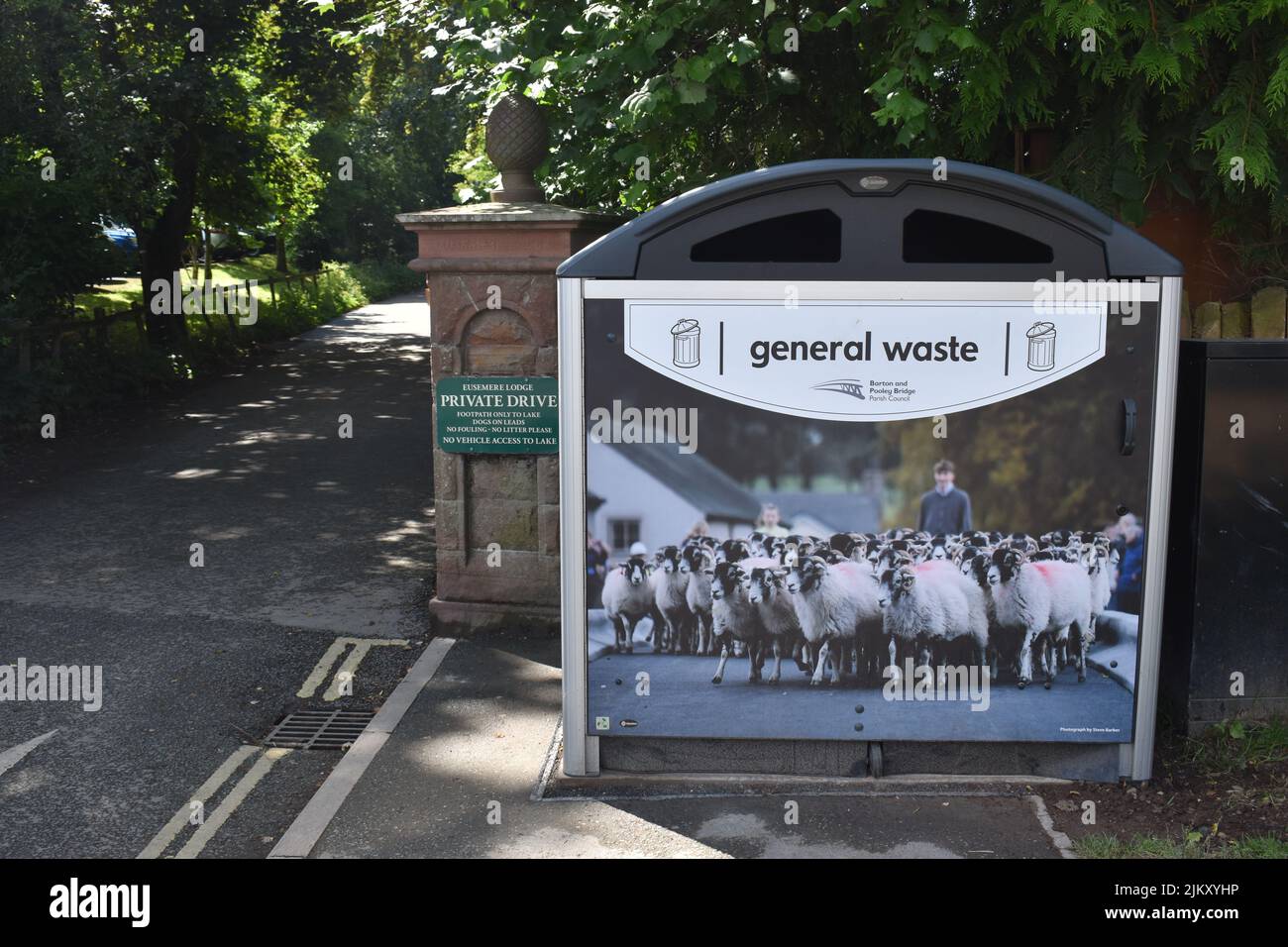 Picturesque waste bin with a picture of sheep in the Lake District National Park. Stock Photo
