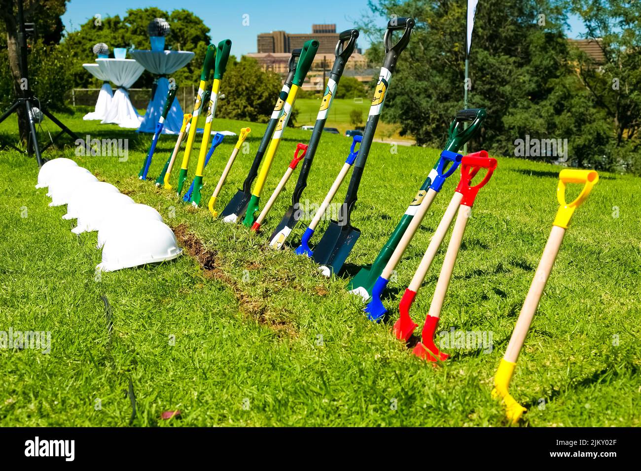 The spades and hard hats for the groundbreaking ceremonies. Johannesburg, South Africa - March 20, 2014: Stock Photo