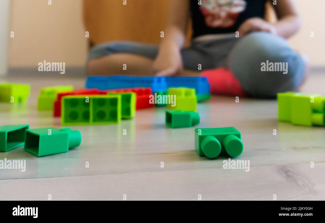little girl playing with toys at home Stock Photo - Alamy