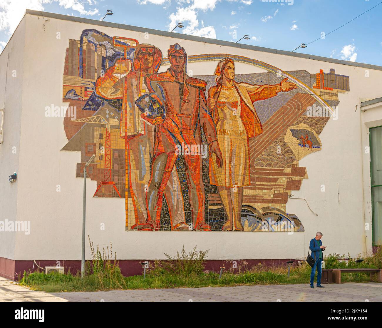 Kazakh tiled mural mosaic on the Union House depicting men and woman of Kazakhstan. Karaganda, Kazakhstan Stock Photo