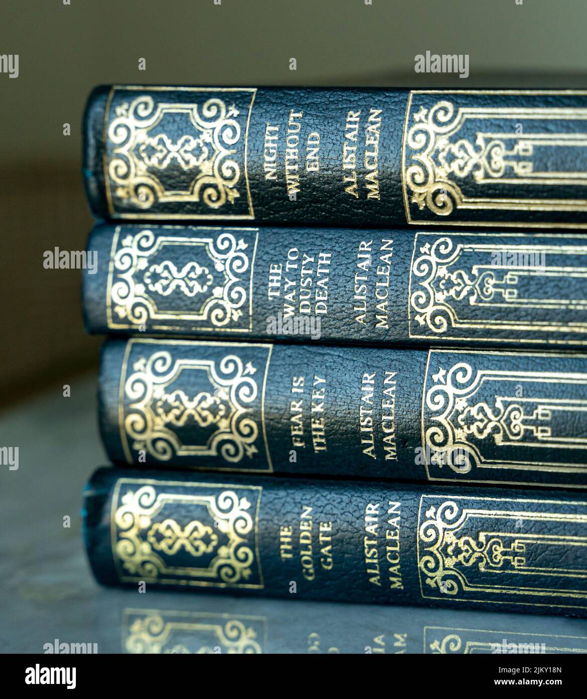 Scottish writer Alistair Maclean books in stack - thriller fiction novels Stock Photo