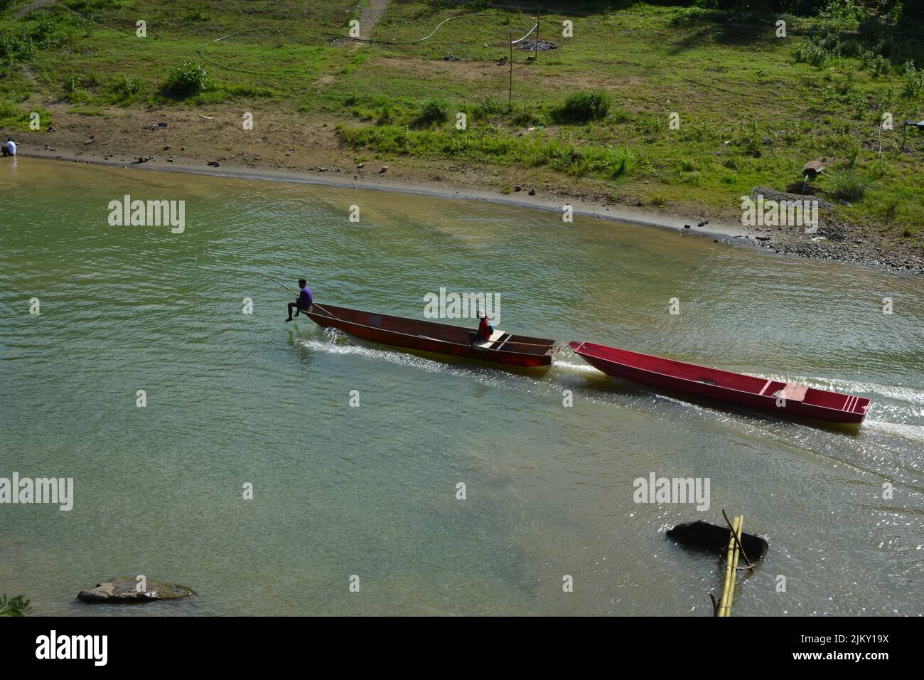 A couple red boats in the Wawa River, Rizal, Philippines Stock Photo