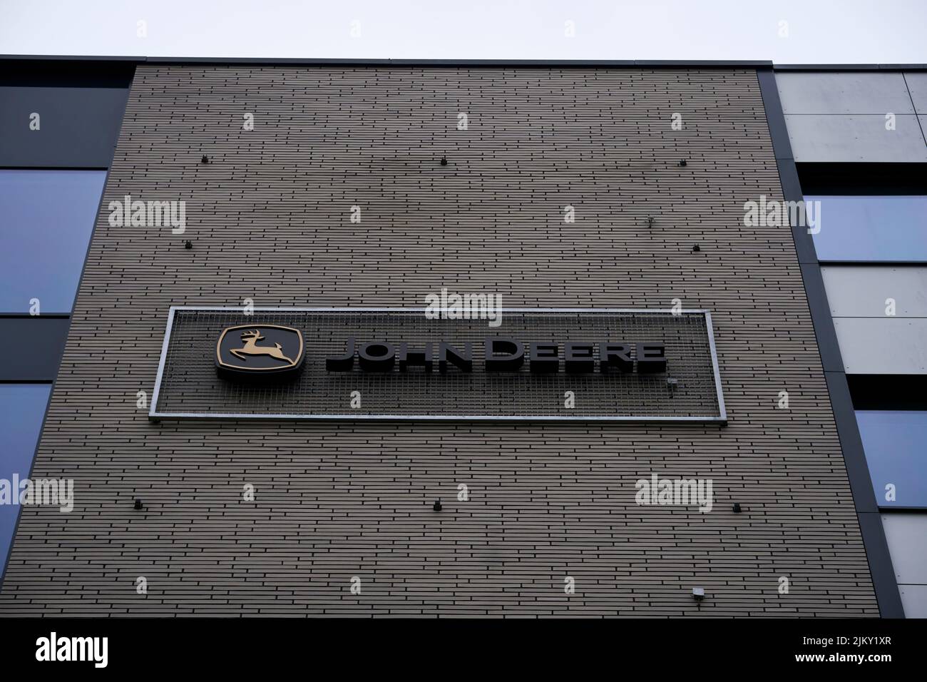 John Deere company logo on a brick wall of the Business Garden office