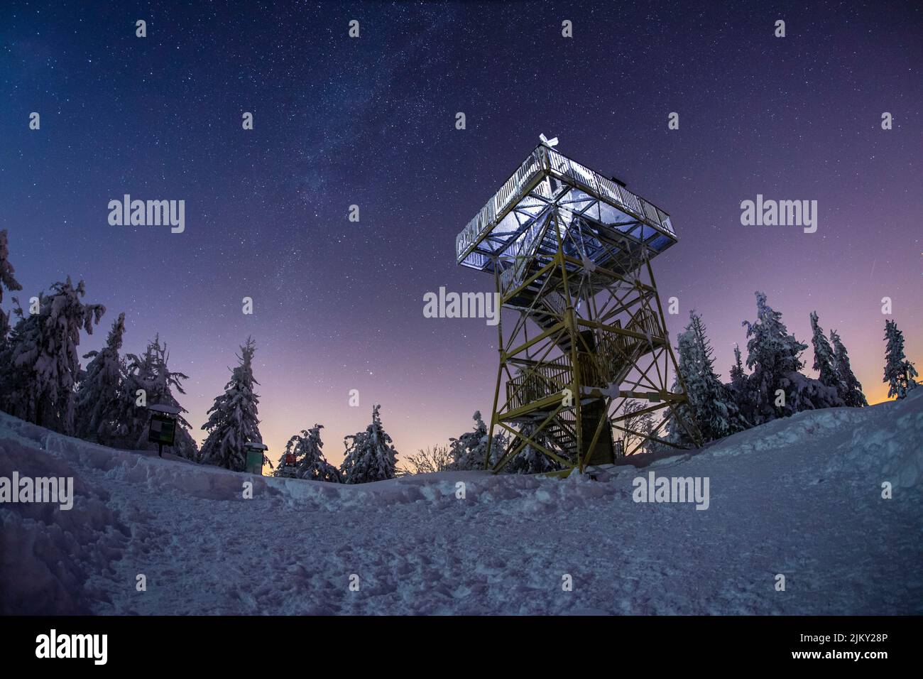 A viewing tower at night with a starry sky background Stock Photo