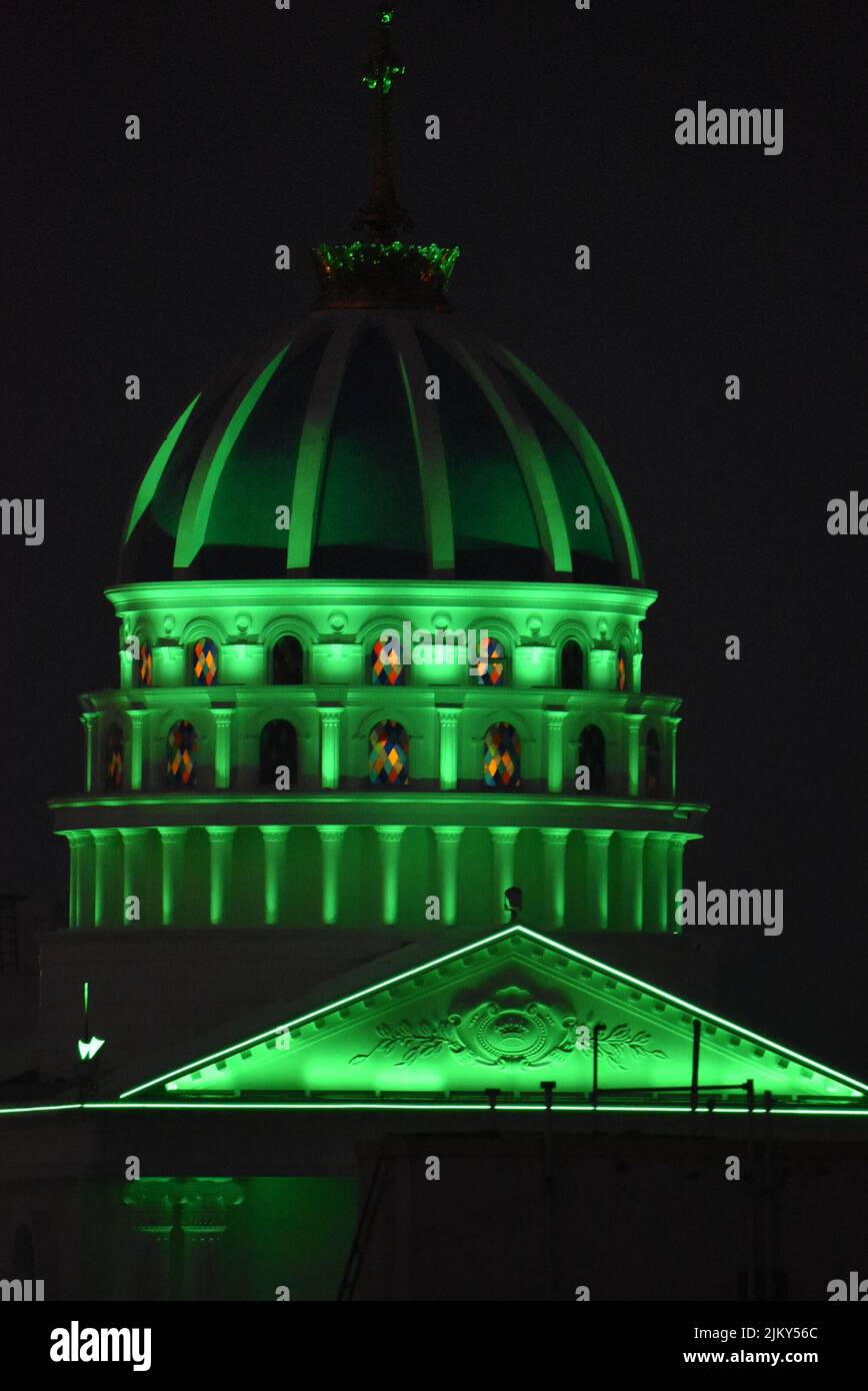 A domed building with green lights Stock Photo