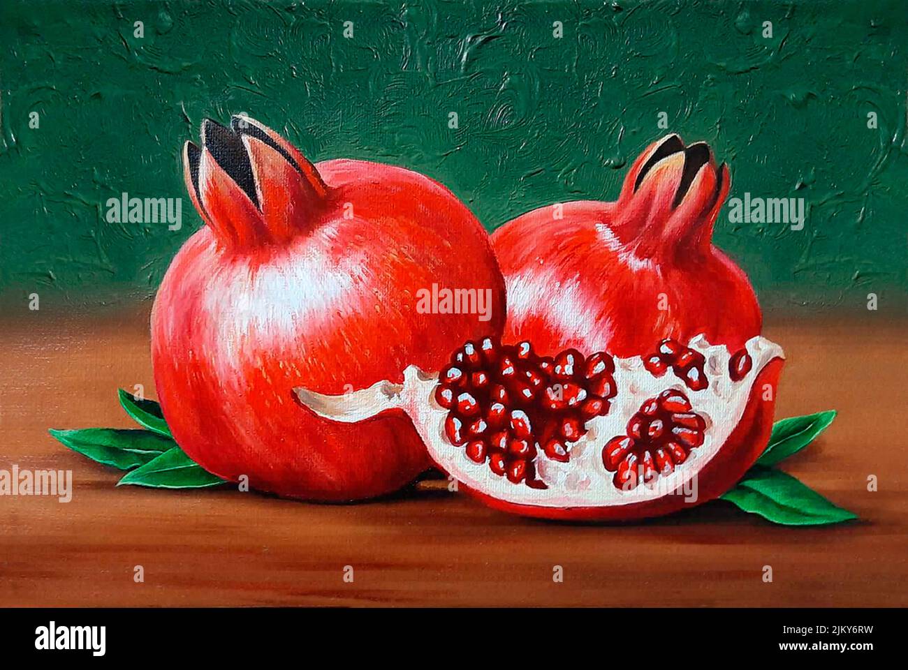 An oil painting depicting a still life of whole and half pomegranates Stock Photo