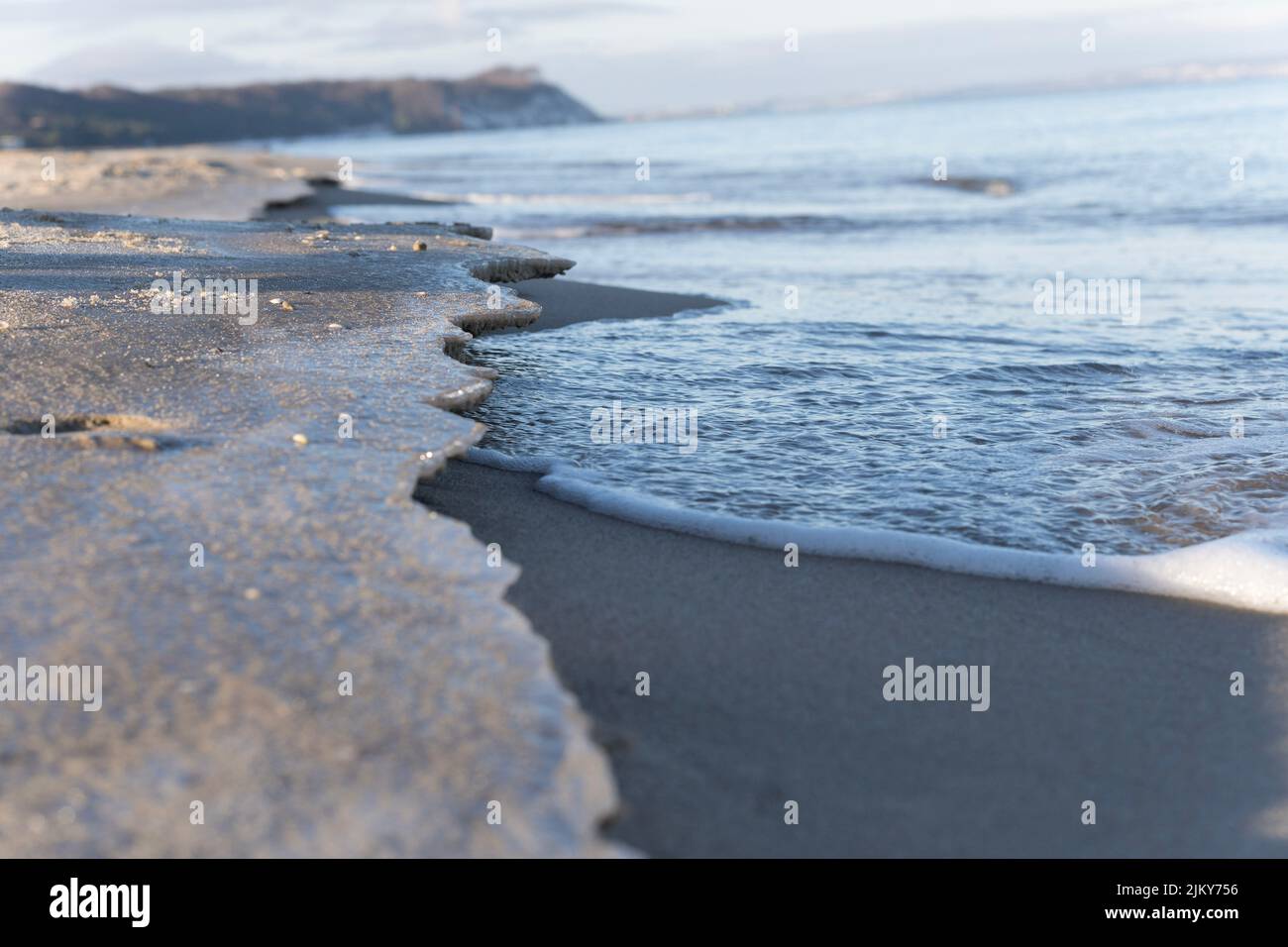 A sandy beach with ice Stock Photo
