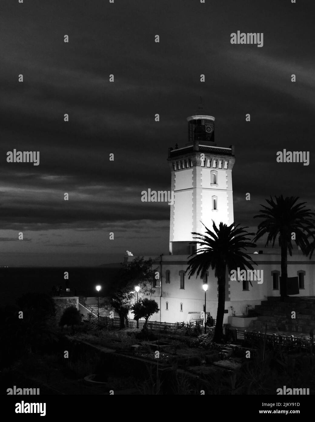 A low angle shot of a modern building during the dark night Stock Photo ...