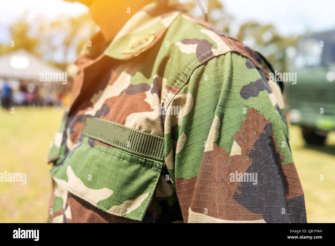 Unrecognizable soldier wearing his military uniform in a boot camp ...