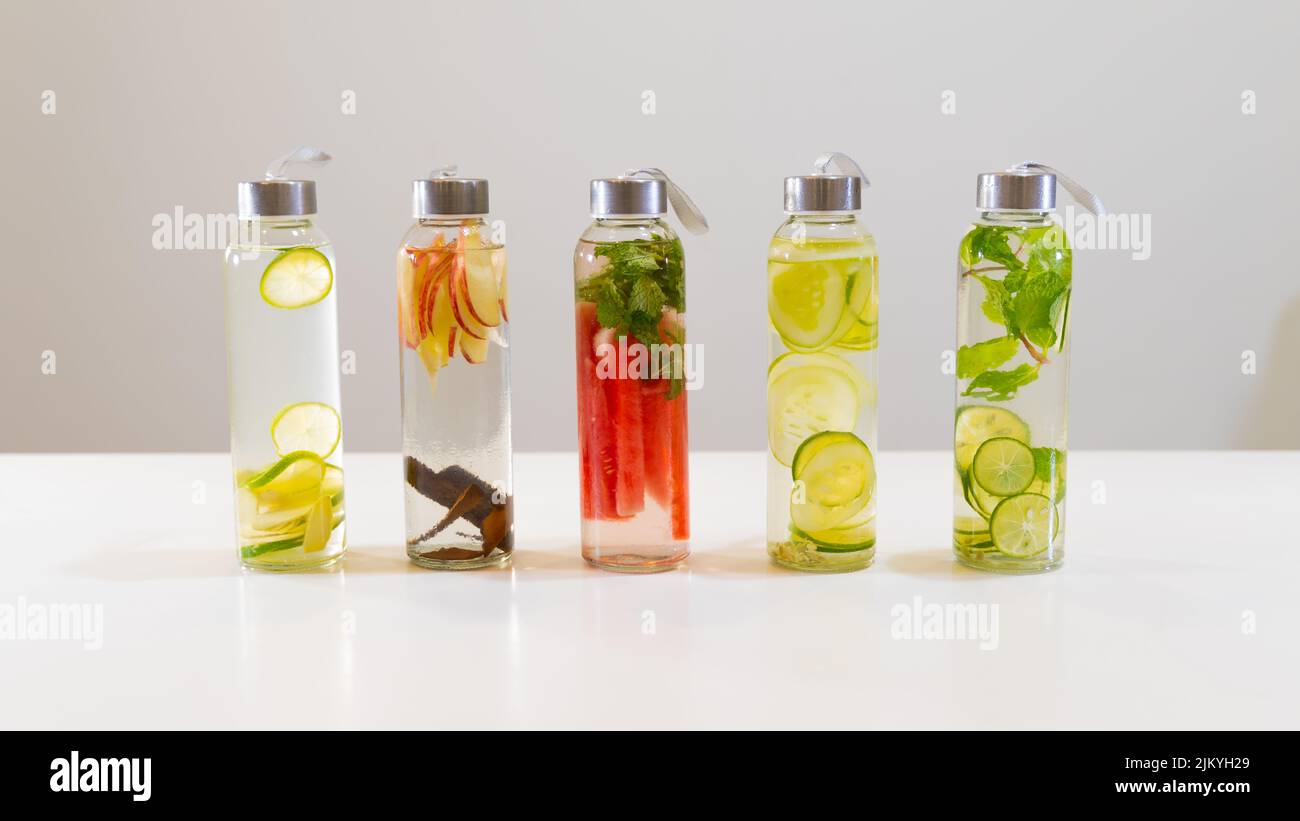 The fresh drinks in small bottles on white table Stock Photo