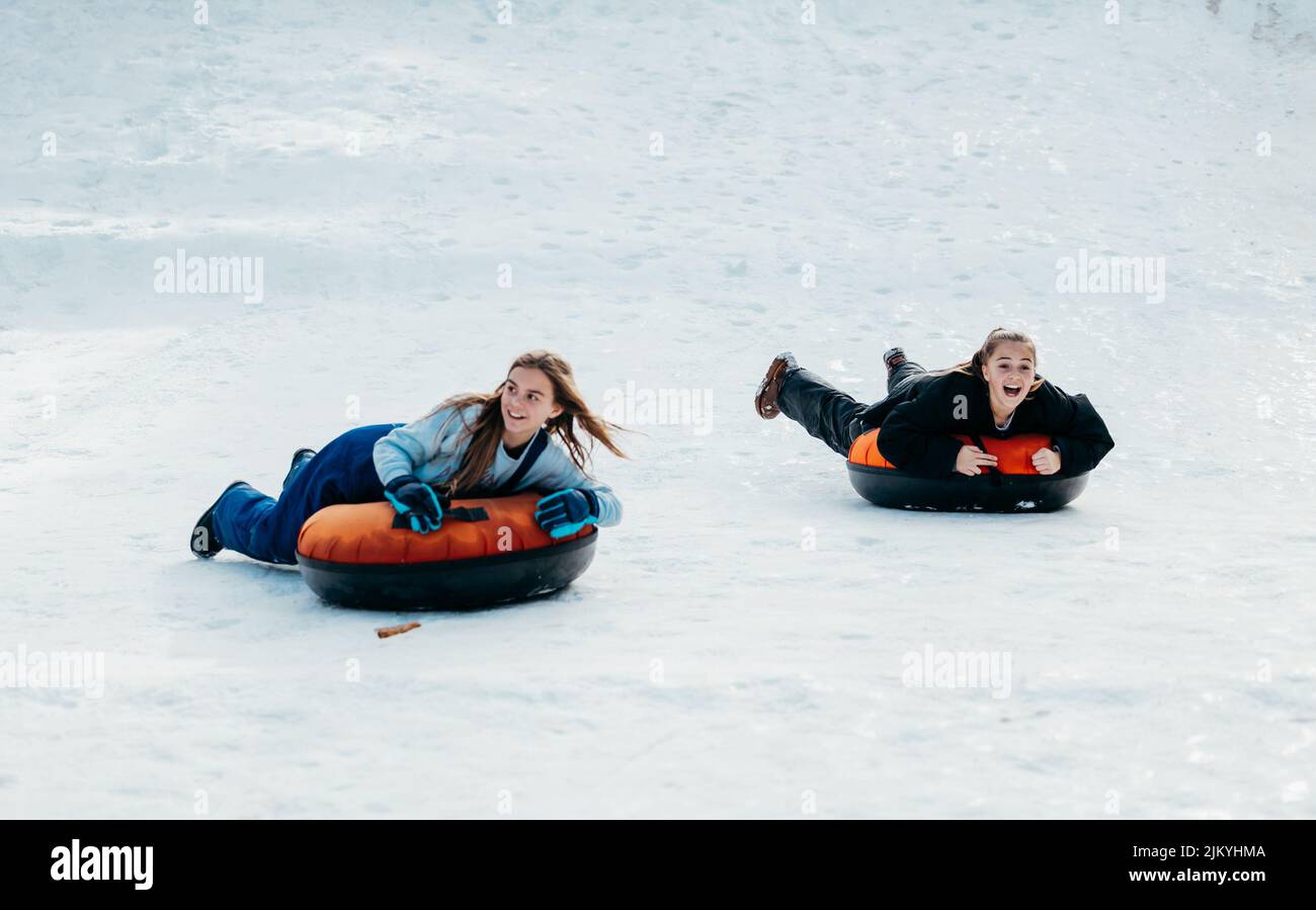 Kids playing the Snow and Tubing Stock Photo Alamy