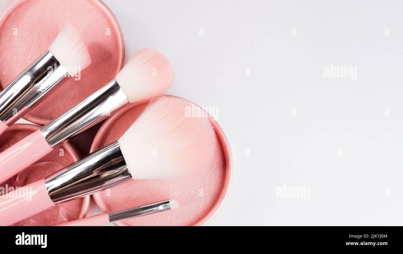 A set of makeup brushes and sponges on a white background Stock Photo