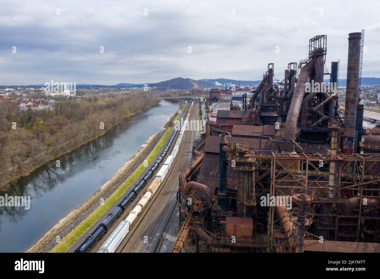 A river flowing near an old industrial site Stock Photo - Alamy