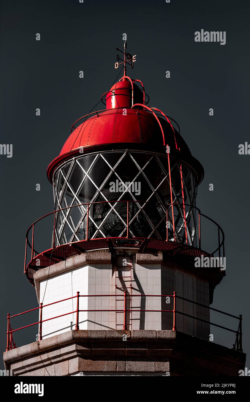 Red lamp tower of a beautiful lighthouse in galicia Stock Photo