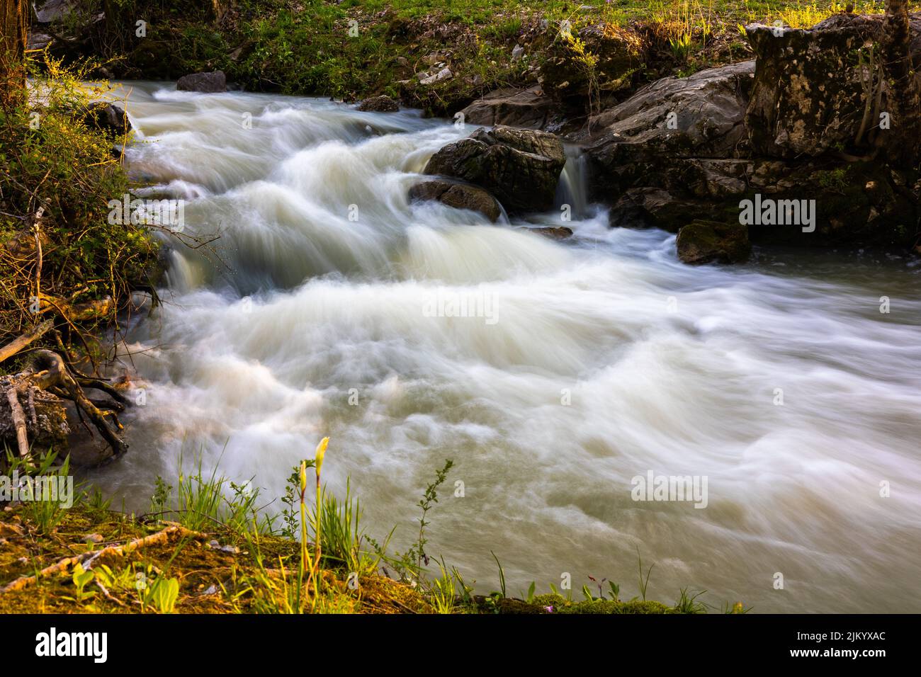 A blurred waterfall in a local creek Stock Photo