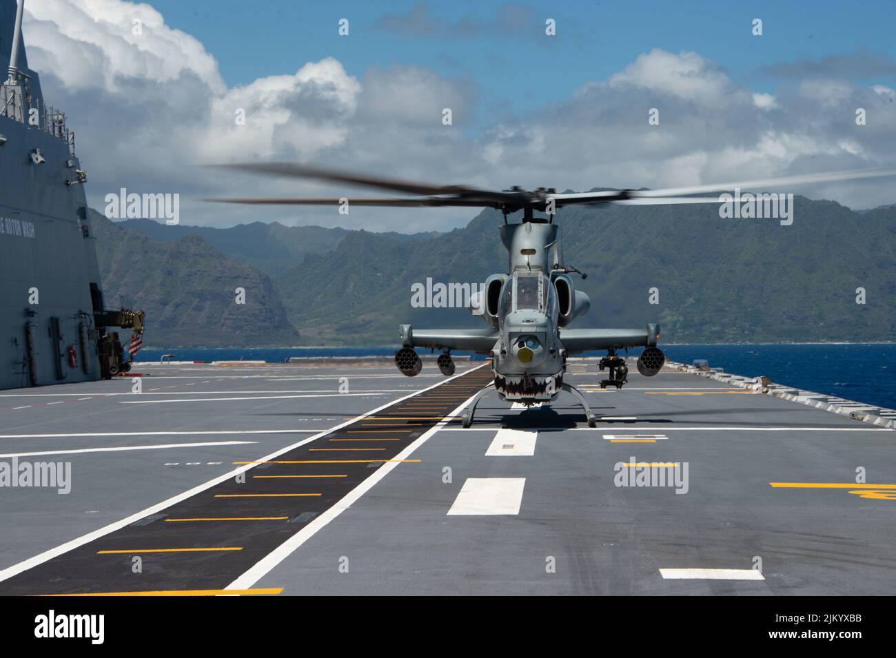 PACIFIC OCEAN (Aug. 1, 2022) U.S. Marine Corps AH-1Z Viper, attached to Marine Light Attack Helicopter Squadron (HMLA) 169, conducts flight operations with Royal Australian Navy Canberra-class landing helicopter dock ship HMAS Canberra (L02), during Rim of the Pacific (RIMPAC) 2022, Aug. 1. Twenty-six nations, 38 ships, three submarines, more than 170 aircraft and 25,000 personnel are participating in RIMPAC from June 29 to Aug. 4 in and around the Hawaiian Islands and Southern California. The world's largest international maritime exercise, RIMPAC provides a unique training opportunity while Stock Photo