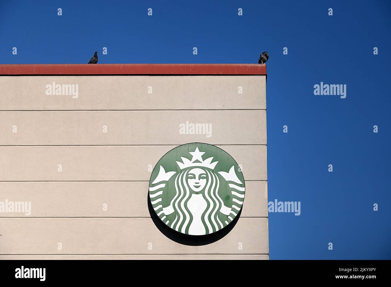 Starbucks coffee shop logo seen on a building in New York, NY, August 3