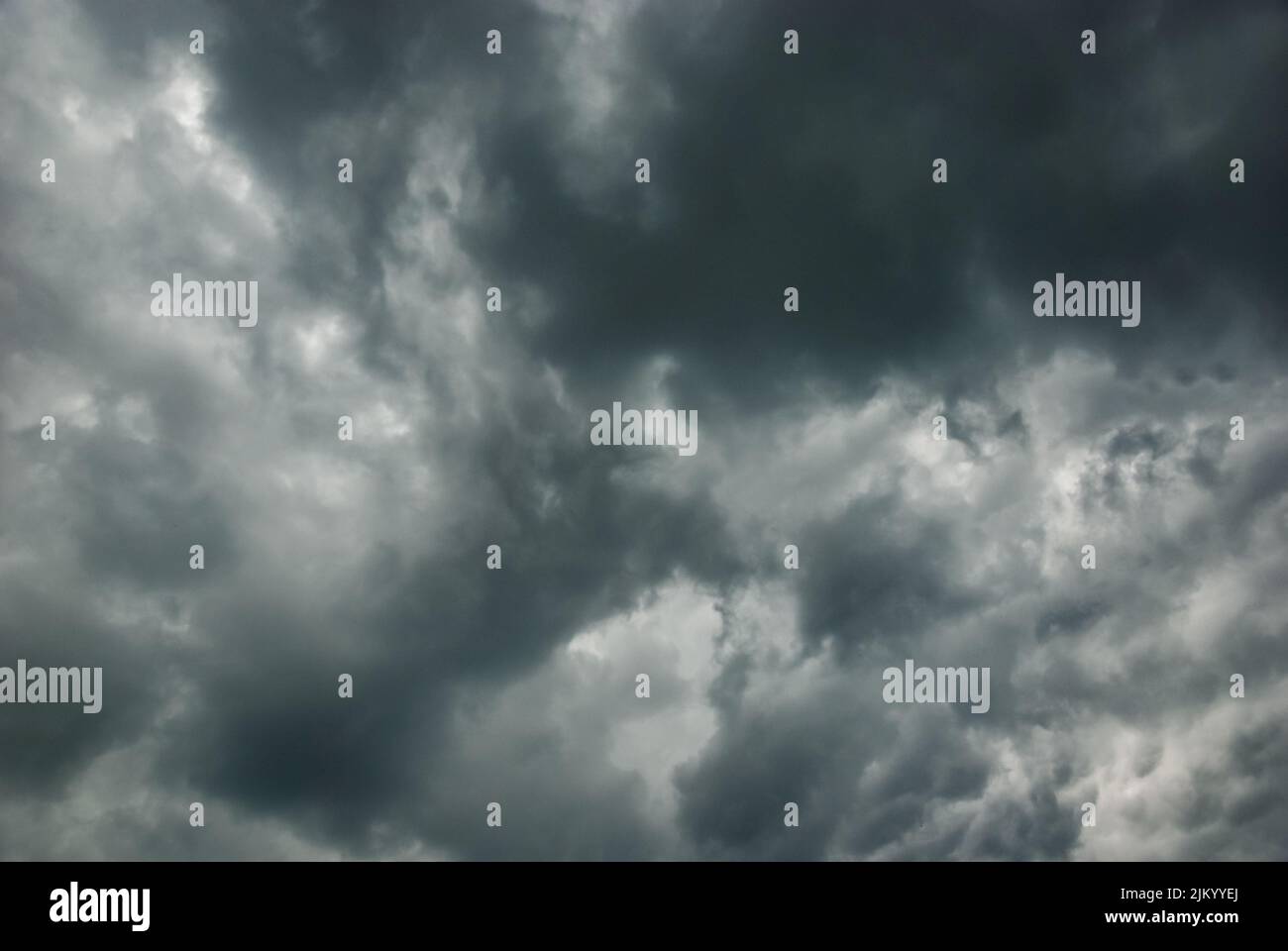 Thunderclouds in stormy sky, dark gray cloudscape before rain Stock Photo