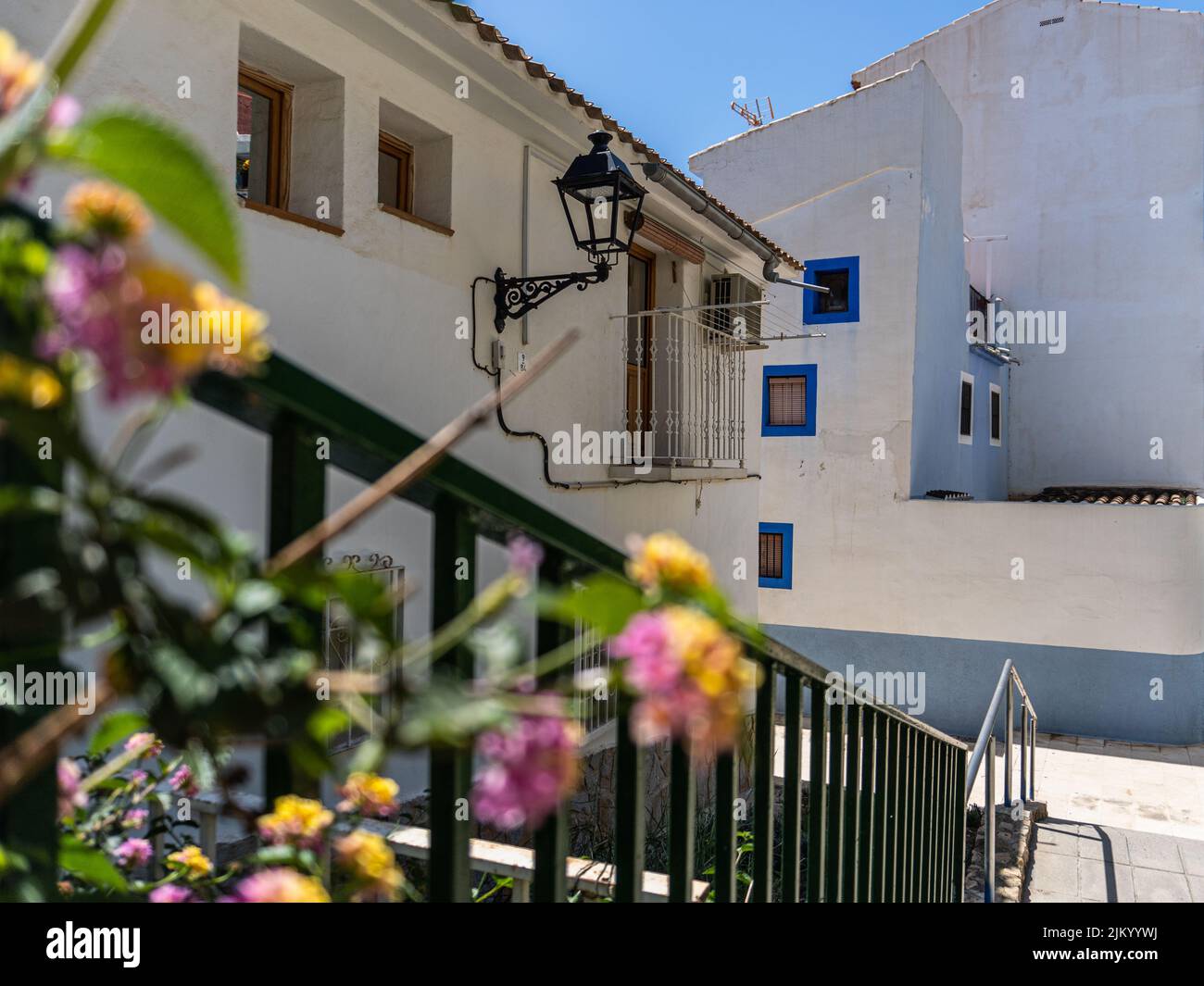 Typical houses and buildings, with facades painted in bright colors, on a sunny day. Villajoyosa, Alicante (Spain) Stock Photo
