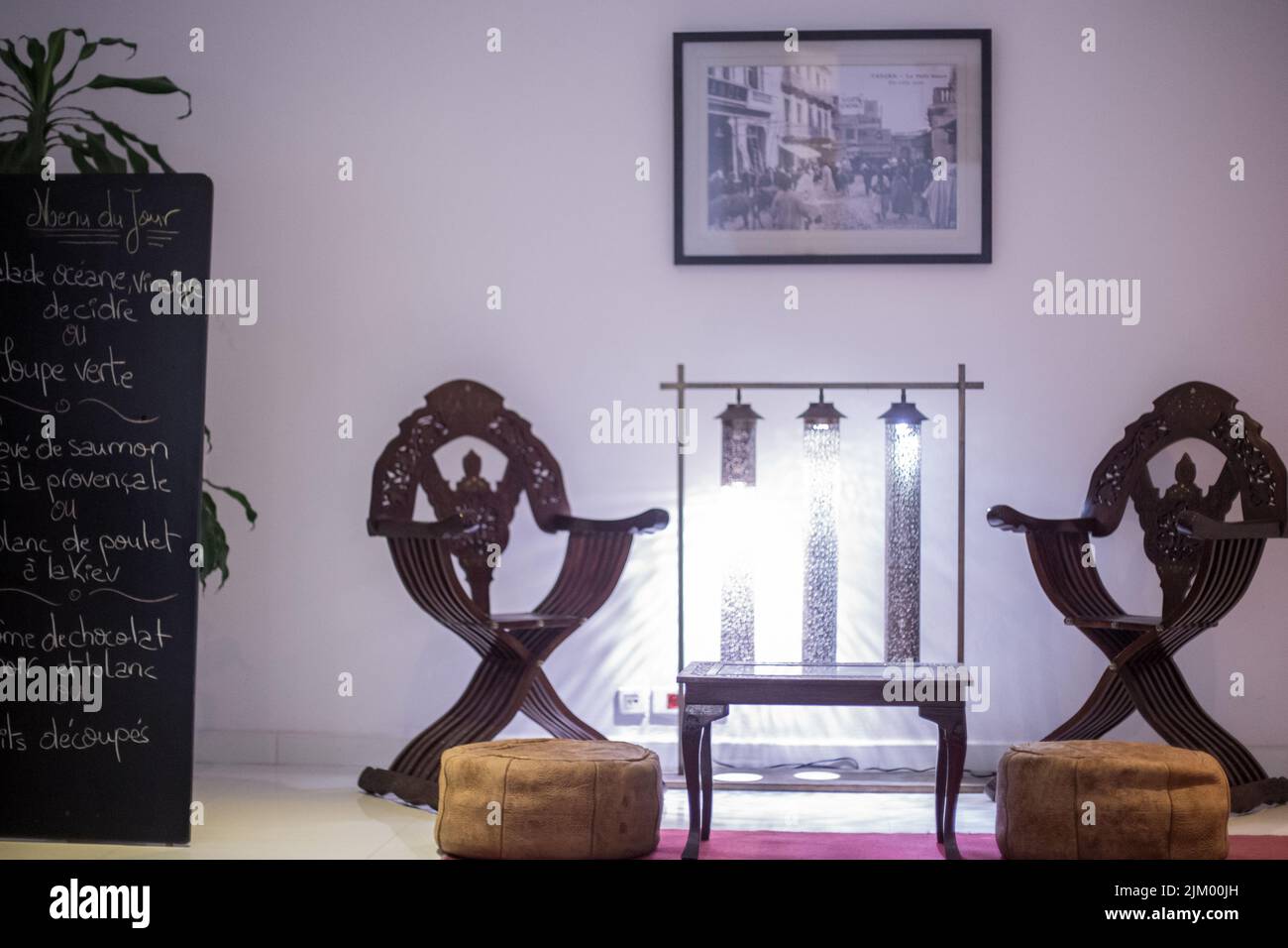 Wooden table with two wooden armchairs next to it in a hotel Stock Photo