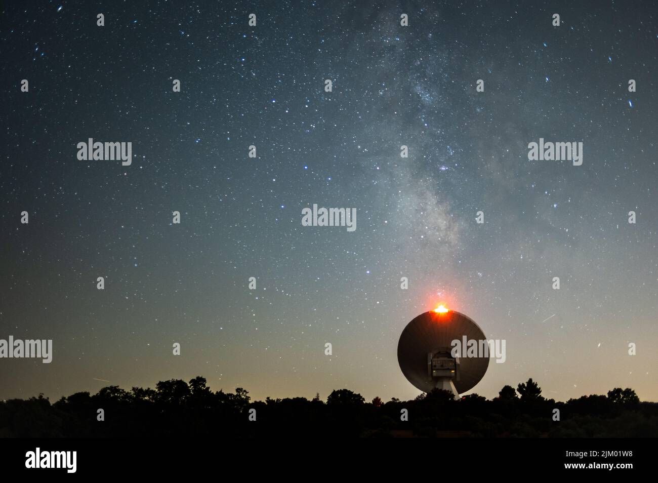Guadalajara, Spain. 04th Aug, 2022. The Milky Way rises during a clear summer night over a radio telescope from the Yebes Observatory, the main scientific and technical facility of the National Geographic Institute of Spain. Credit: Marcos del Mazo/Alamy Live News Stock Photo