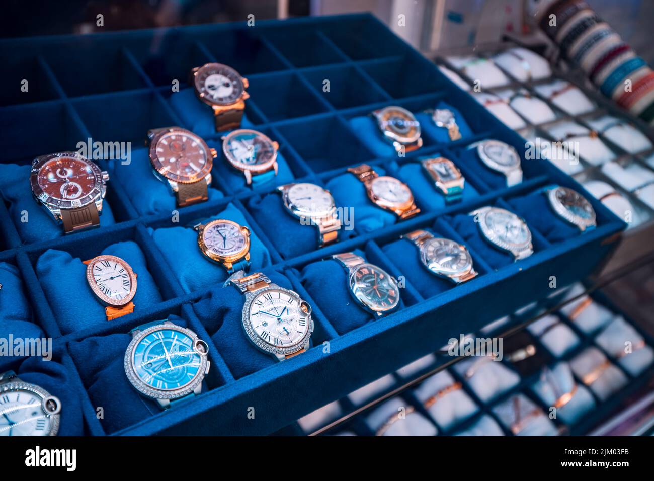 21 June 2022, Antalya, Turkey: Many vintage retro and modern Cartier luxury wristwaches and clocks for sale at store window Stock Photo