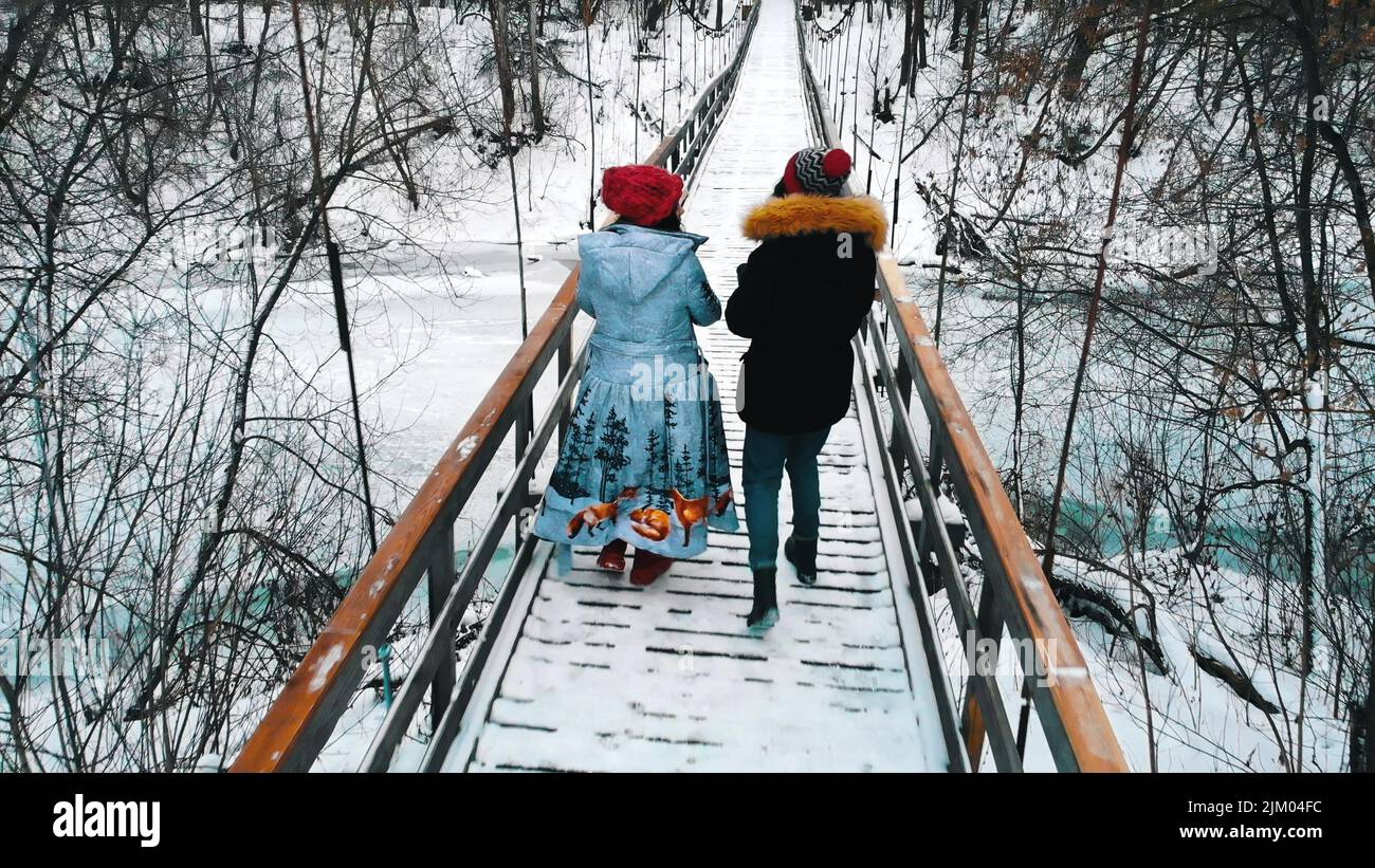 Two women on snowy bridge hi-res stock photography and images - Alamy