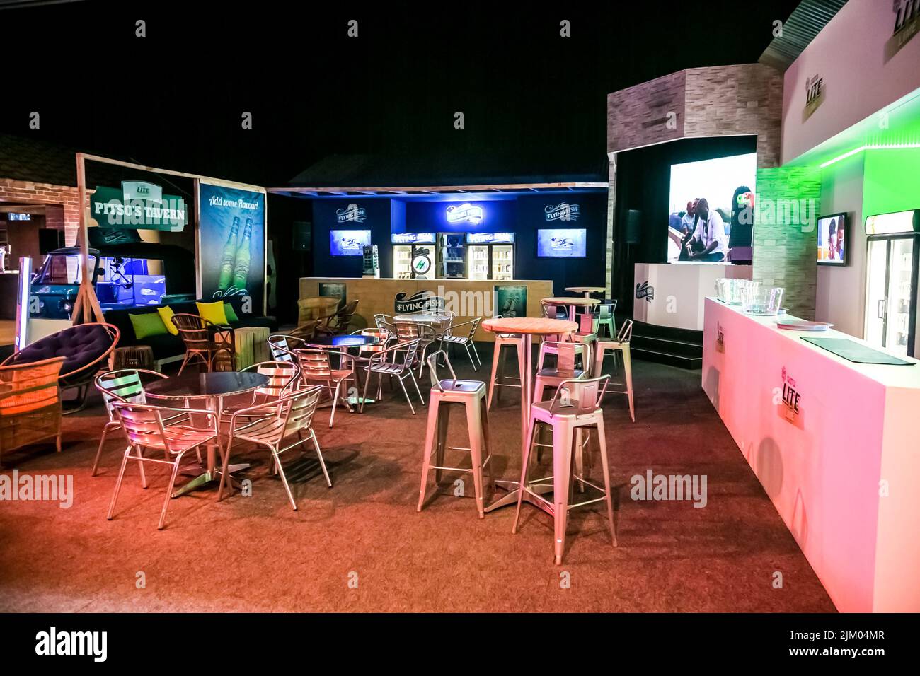 The interior of an alcohol bar and tavern with tables and chairs indoor