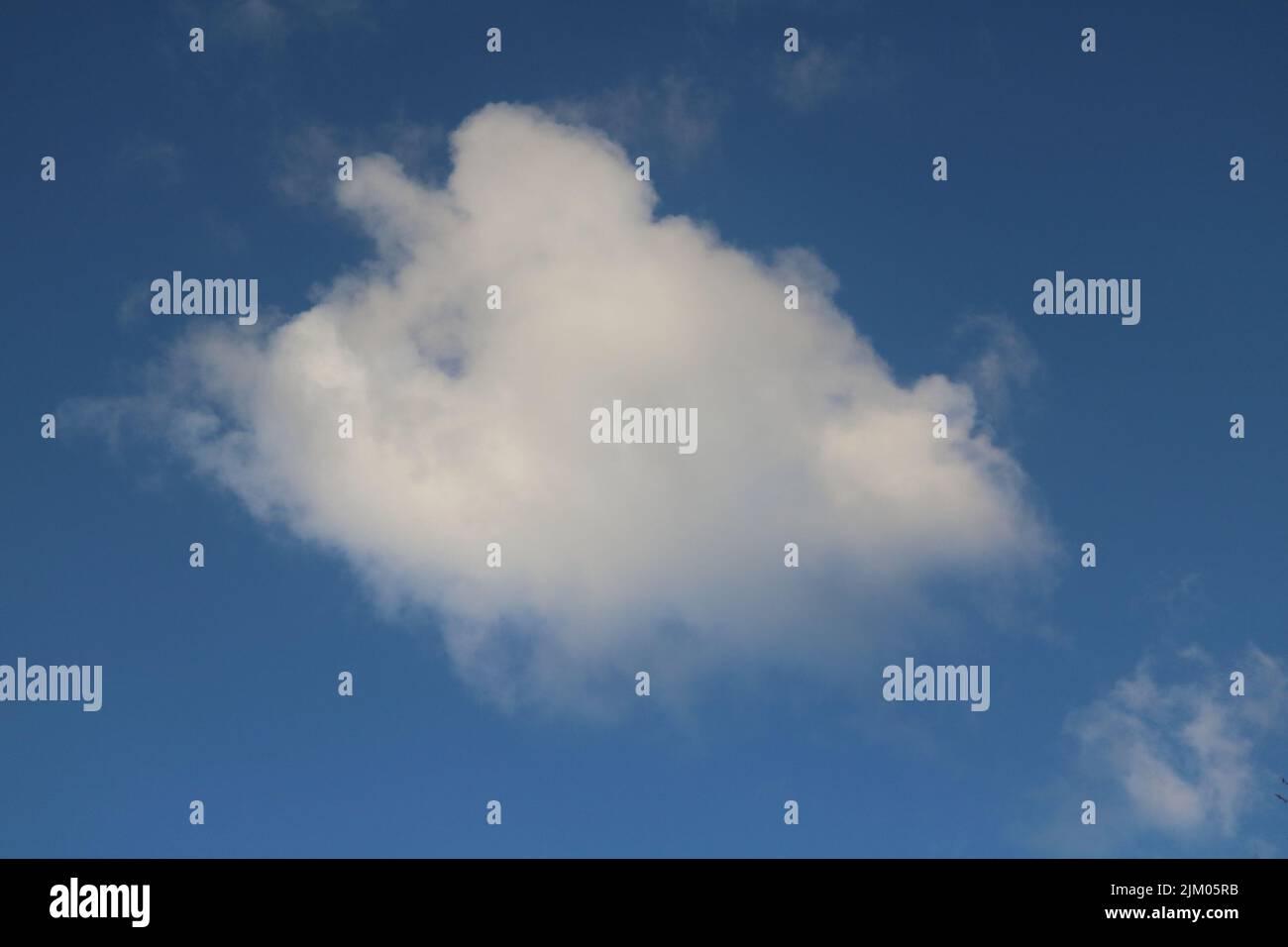 A beautiful view of fluffy clouds in the blue sky Stock Photo - Alamy