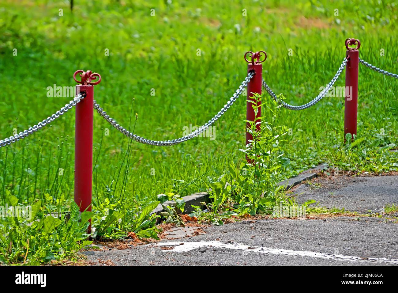 silver metal chain barrier, daylight green environment diversity Stock