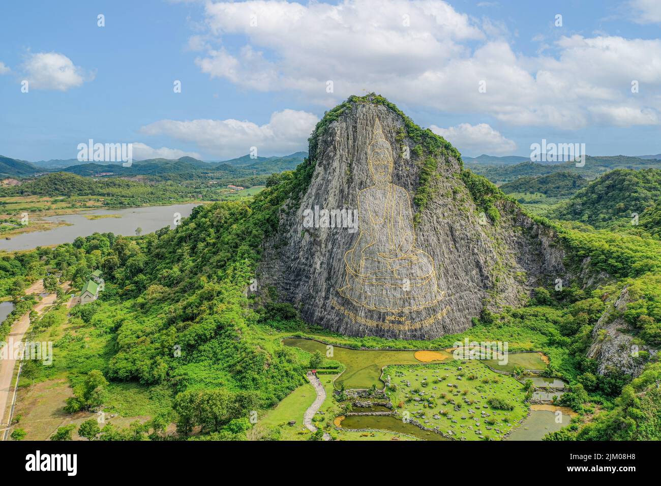 Buddha Mountain or Khao Chi Chan is a limestone hilltop in Na Chom Thian that has become a Pattaya landmark due to its 109m by 70m golden Buddha laser Stock Photo