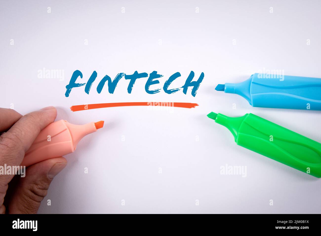 Fintech. Text and colored markers on a white background. Stock Photo